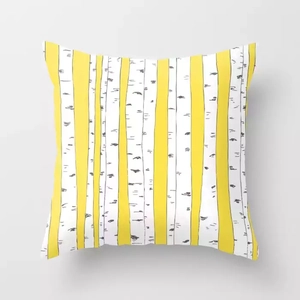 Detailed view of square pillow case with yellow and white stripes and birch bark patterns