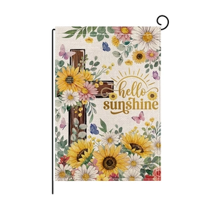 Detail of garden flag texture with sunflower cross design and hello sunshine text
