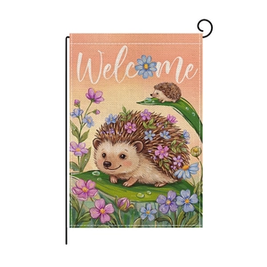 Detail of hedgehogs with flowers and Welcome text on a textured garden flag fabric