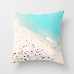 Close-up of peach skin pillowcase featuring high-definition beach photography print