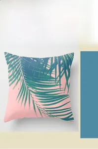 Detail of tropical palm leaf pattern on pink polyester decorative pillowcase with digital print