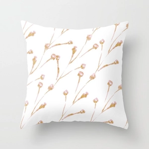 Close-up of decorative peach skin pillowcase with pink floral and gold glitter pattern