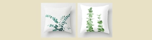 Detail of eucalyptus leaf patterns on white polyester pillowcases with symmetric designs