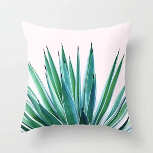 Detailed close-up of a square peach skin pillowcase with green agave plant print