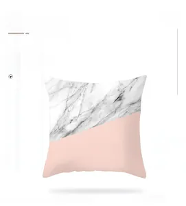 Detail of square marble pattern and pink peach skin fabric cushion cover for sofa