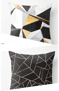 Close-up of geometric peach skin fabric pillowcase with gold marble pattern and black lines