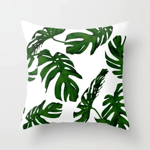 Detail of tropical monstera leaf print on peach skin pillowcase with fine texture