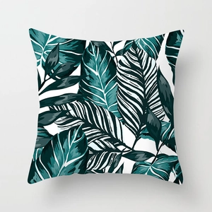 Detailed macro view of tropical monstera leaf patterns on soft peach skin pillowcase