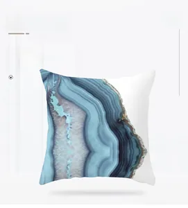Detail view of modern blue agate pattern print on soft peach skin throw pillow case