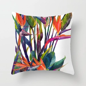 Detail of colorful watercolor bird of paradise flower on soft peach skin pillow cover