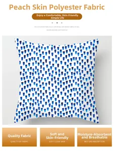 Close-up of abstract blue and white droplet print on soft peach skin polyester fabric
