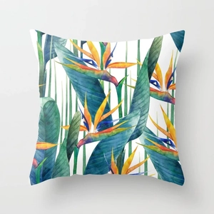 Close-up of bird of paradise tropical leaf watercolor print on square peach skin pillowcase