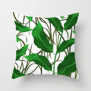 Tropical rainforest leaf print throw pillow cover with green foliage on white fabric
