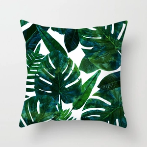 Detail showing the realistic tropical monstera leaves print on square peach skin pillowcase