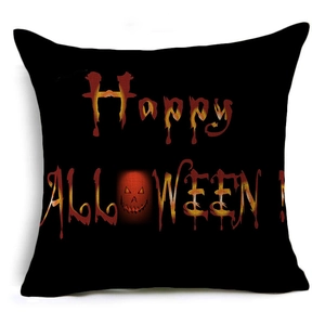Detail of black linen Halloween pillowcase with Happy Halloween text and pumpkin face