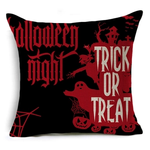Detail view of Halloween linen pillowcase featuring red Trick or Treat text and pumpkin motifs