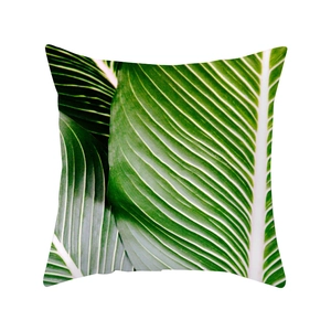 Square tropical leaf pillow case featuring vibrant green rainforest plant patterns