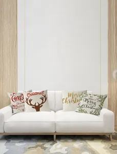 Set of four Christmas throw pillow covers with reindeer and festive quotes on sofa