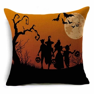 Detail of Halloween pumpkin trick or treat cushion cover with silhouette of kids and moon