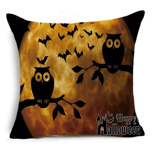 Close-up of linen Halloween pillow cover with owl silhouette and Happy Halloween text