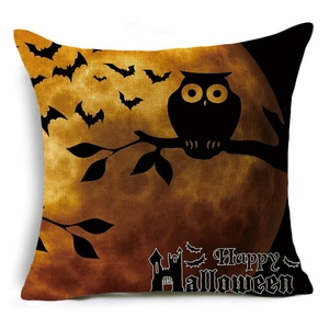 Detail of Halloween pillowcase with owl and bats print on textured fabric surface