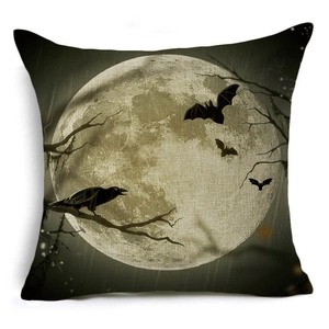 Close-up of Halloween linen pillowcase featuring crow and bat silhouettes on full moon