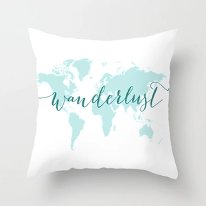 Detailed close-up of wanderlust world map print on geometric polyester cushion cover