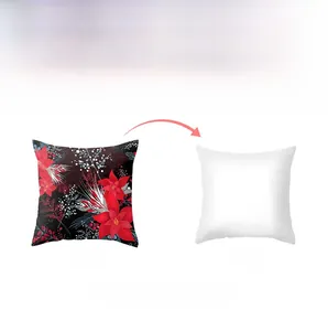 Detail of Christmas cushion cover with red poinsettia print and plain white reverse