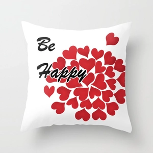 Modern square throw pillow with red heart circle pattern and Be Happy text on white fabric