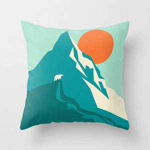 Detail of square cushion cover with geometric polar bear and mountain sunrise print