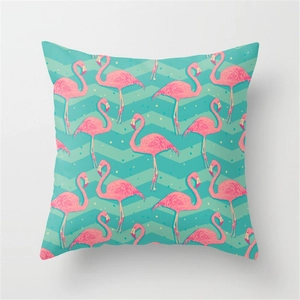 Tropical flamingo decorative pillow with mint green wavy patterns and yellow polka dots