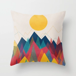 Detail of artistic sunrise and mountain print on soft beige square throw pillow cover