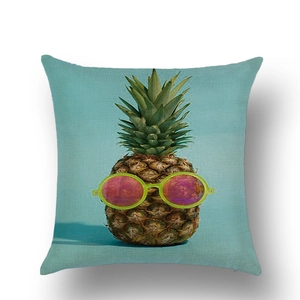 Detailed texture of linen cushion cover featuring a colorful pineapple with sunglasses print