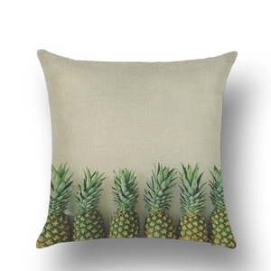 Close-up of tropical pineapple print on rustic linen cushion cover with fabric texture