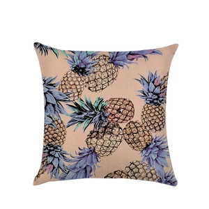 Linen pillow cover featuring a tropical painted pineapple pattern on a light orange base