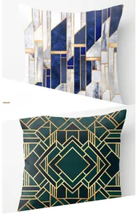 Detail of pink marble and geometric pillow cases with blue gold and green art deco patterns