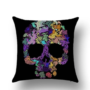 Detail shot of black linen pillow case featuring a colorful abstract skull print