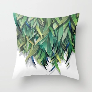 Detail of green tropical leaf pattern on peach skin pillowcase with geometric art print