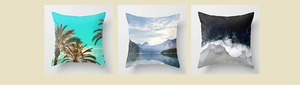 Detailed view of three peach skin pillow covers featuring tropical and ocean landscape prints