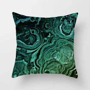 Detailed view of the green malachite texture on a square peach skin fabric cushion cover
