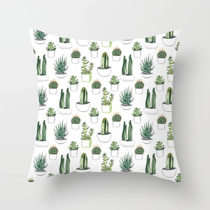Detail of square pillowcase featuring watercolor succulent and cactus print on white fabric