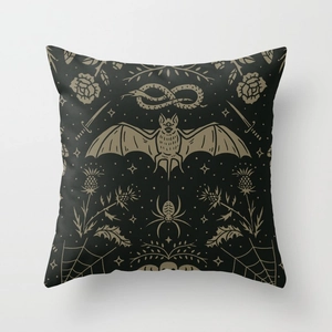Gothic Halloween throw pillow featuring a golden bat, snake, and spider on black polyester