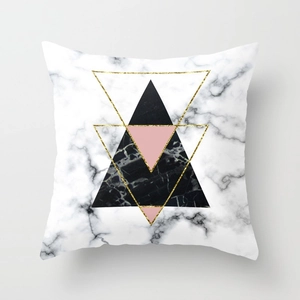 Detailed close-up of geometric marble texture and golden line patterns on square pillowcase