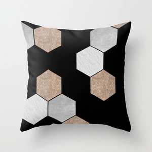 Detail of geometric peach skin pillowcase with black marble and rose gold hexagon patterns