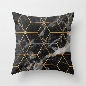 Detail of square pillowcase with black marble pattern and gold geometric hexagon lines