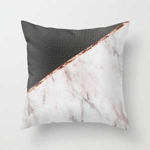 Detail of geometric pillowcase with marble texture, pink accents and rose gold line