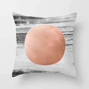 Detailed texture of geometric peach skin pillowcase with metallic rose gold circle design