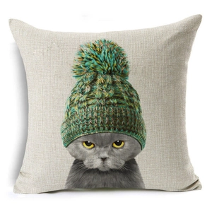 Detail of linen texture pillowcase featuring a grumpy cat in a green knitted hat