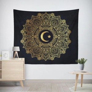 Detail of black and gold mandala tapestry featuring a crescent moon and star design