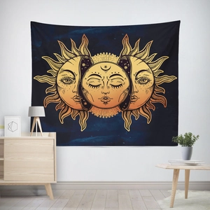 Detail of bohemian sun and moon tapestry on a white wall with minimalist room decor